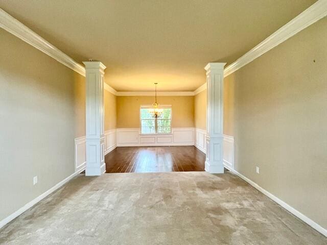 603 Yonto Dr, Grovetown, GA 30813 - carpeted empty room featuring ornate columns, ornamental molding, a wainscoted wall, and baseboards