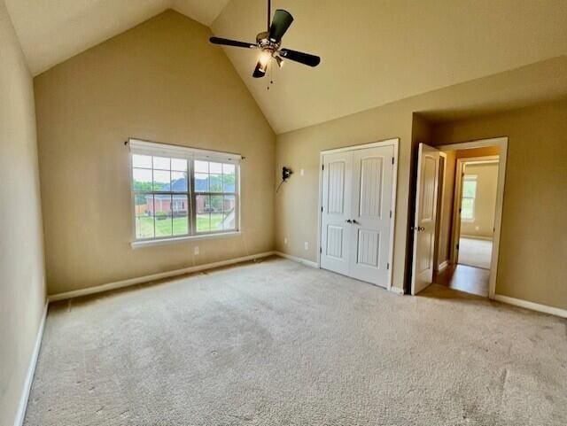603 Yonto Dr, Grovetown, GA 30813 - unfurnished bedroom featuring a closet, high vaulted ceiling, carpet flooring, and baseboards