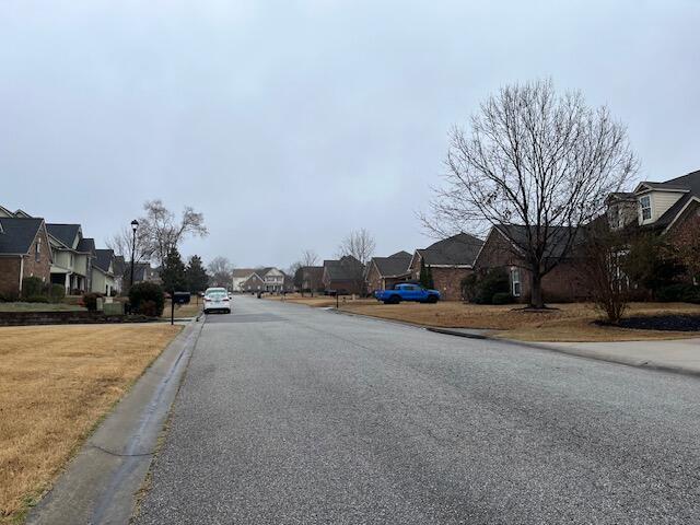 603 Yonto Dr, Grovetown, GA 30813 - view of asphalt street featuring a residential view, curbs, and street lighting