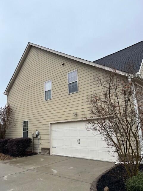 603 Yonto Dr, Grovetown, GA 30813 - view of home's exterior with driveway, roof with shingles, and an attached garage