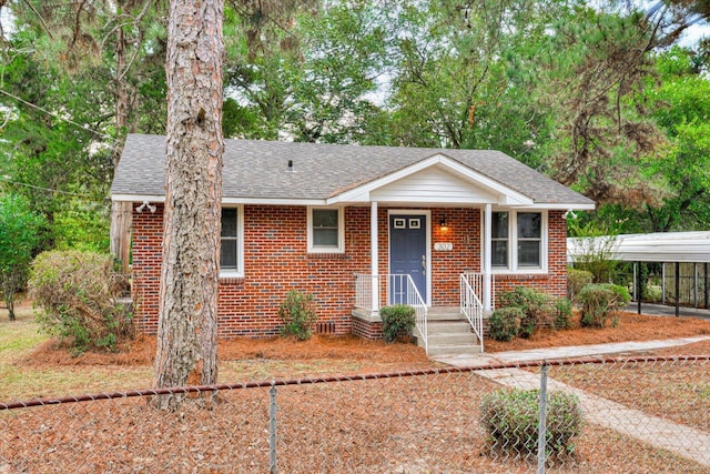 view of front of property with a carport