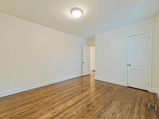 1904 Robin Rd, North Augusta, SC 29841 - unfurnished bedroom with dark wood-style flooring and baseboards