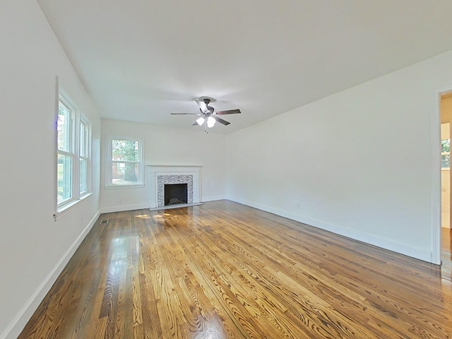 1904 Robin Rd, North Augusta, SC 29841 - unfurnished living room featuring wood finished floors, a ceiling fan, and a fireplace with flush hearth