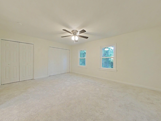 1904 Robin Rd, North Augusta, SC 29841 - unfurnished bedroom featuring multiple closets, carpet, and a ceiling fan