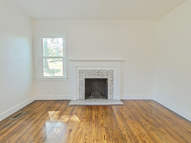 1904 Robin Rd, North Augusta, SC 29841 - unfurnished living room featuring wood finished floors and a fireplace