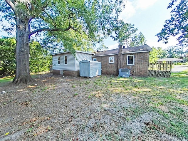 1904 Robin Rd, North Augusta, SC 29841 - back of house with a storage unit and brick siding