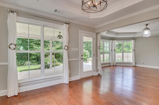 474 Sebastian Dr, Grovetown, GA 30813 - doorway with a raised ceiling, a chandelier, wood finished floors, and ornamental molding