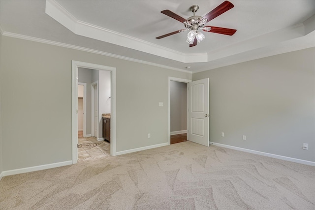 474 Sebastian Dr, Grovetown, GA 30813 - unfurnished bedroom with a tray ceiling, ornamental molding, light colored carpet, connected bathroom, and a ceiling fan