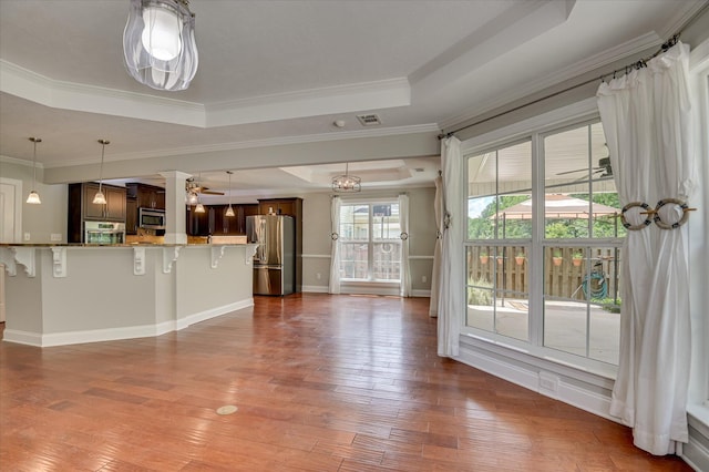 474 Sebastian Dr, Grovetown, GA 30813 - unfurnished living room with a raised ceiling, wood-type flooring, ornamental molding, and a ceiling fan