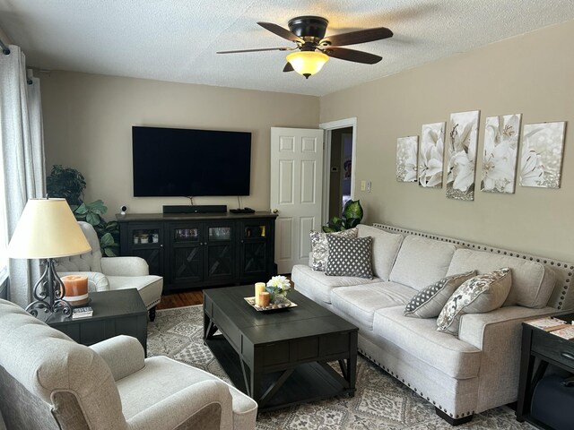living room featuring wood finished floors and ceiling fan