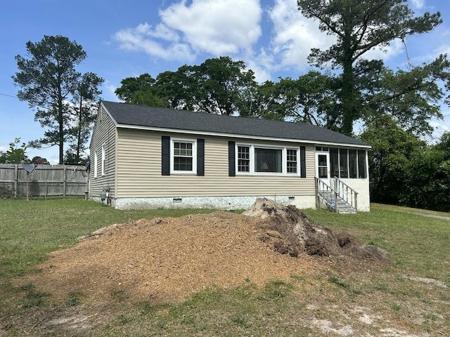 manufactured / mobile home featuring a sunroom, crawl space, a front yard, and fence