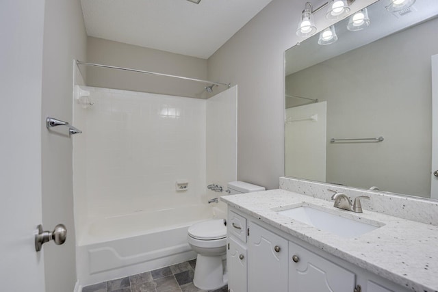 bathroom with shower / washtub combination, toilet, and vanity