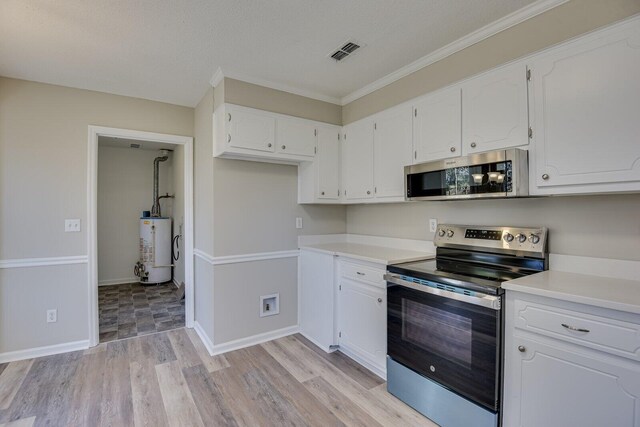 kitchen with visible vents, light wood finished floors, stainless steel appliances, white cabinets, and gas water heater