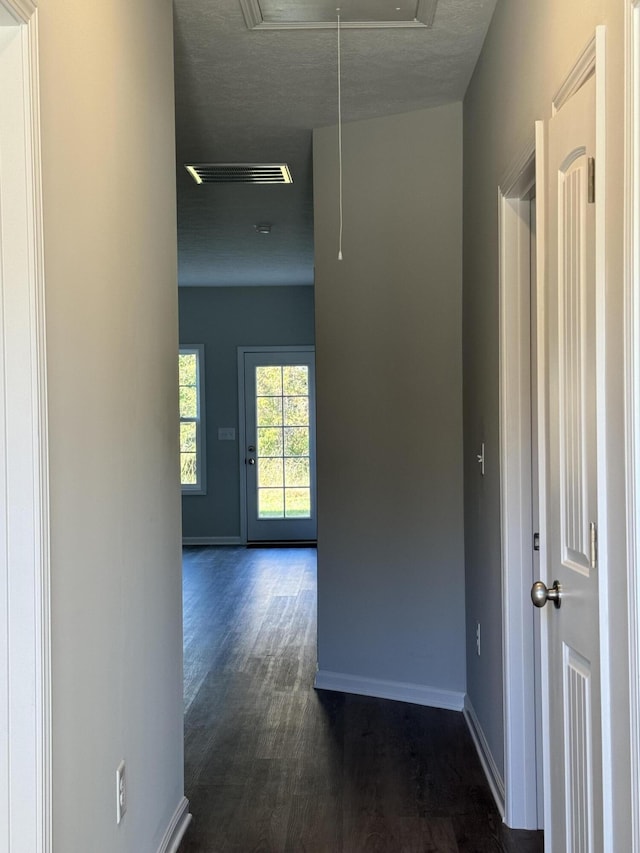 corridor with a textured ceiling