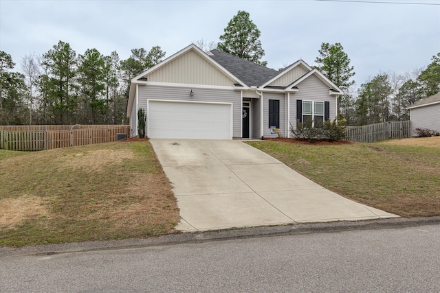 view of front facade with a garage and a front lawn