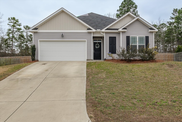 view of front facade with a front yard and a garage