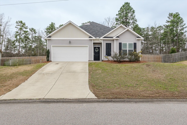 ranch-style home with a garage and a front yard