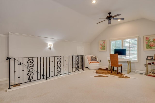 interior space with baseboards, vaulted ceiling, and carpet flooring