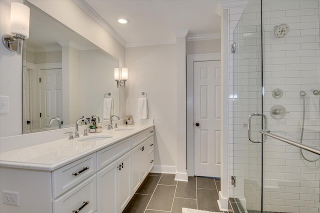 full bath featuring double vanity, ornamental molding, a sink, and a shower stall