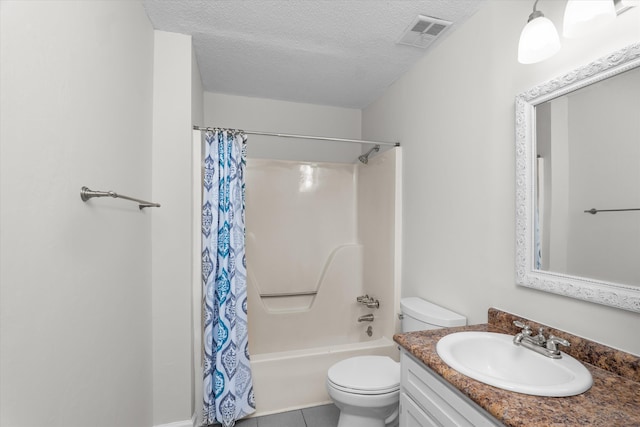 full bathroom featuring shower / tub combo with curtain, tile patterned flooring, vanity, toilet, and a textured ceiling