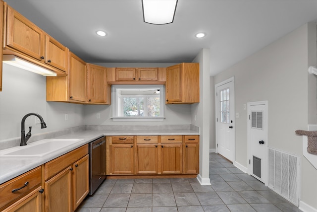 kitchen featuring light tile patterned flooring, dishwasher, and sink