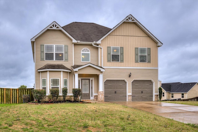 view of front of home with a garage and a front yard