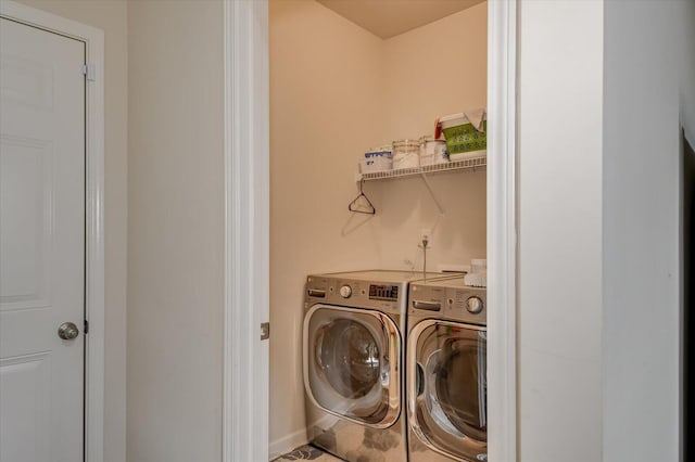 laundry room with independent washer and dryer