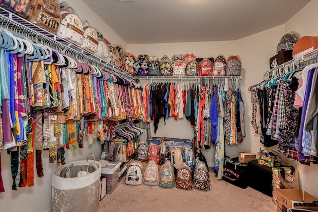 walk in closet with carpet