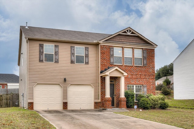 view of front of house featuring a front yard and a garage