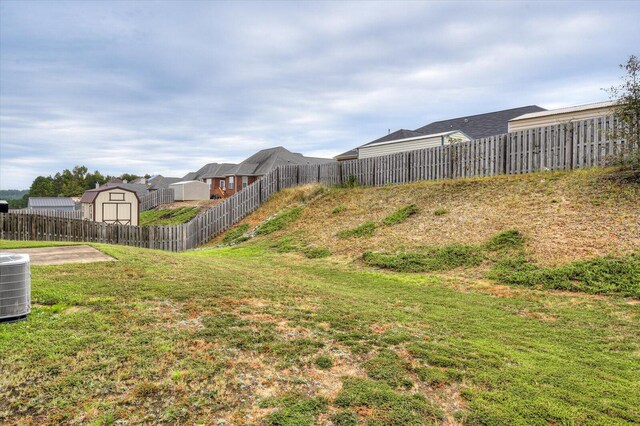 view of yard featuring central air condition unit