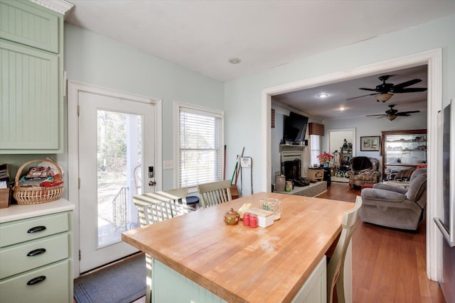 dining area featuring ceiling fan and light wood-type flooring