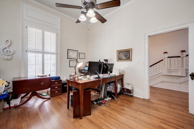 office featuring ornamental molding, ceiling fan, and light hardwood / wood-style floors