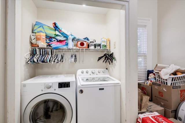 clothes washing area featuring washing machine and clothes dryer