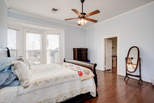 bedroom with ceiling fan, multiple windows, and crown molding