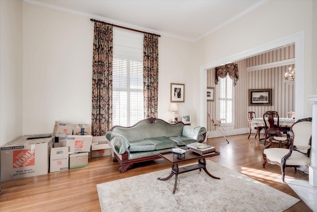 living room featuring hardwood / wood-style flooring, a notable chandelier, and a wealth of natural light