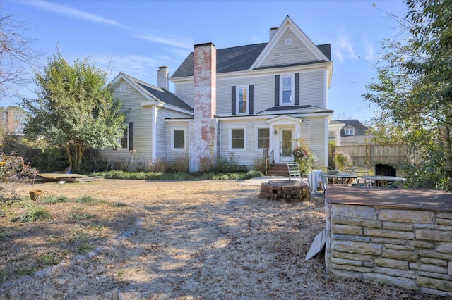 view of front of property with an outdoor fire pit