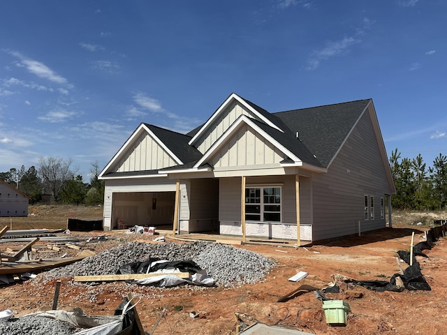 view of front of home featuring a porch, board and batten siding, and an attached garage