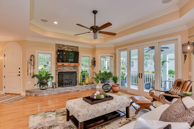 2051 Waterbridge Ln, Aiken, SC 29803 - living room featuring ceiling fan, a raised ceiling, wood finished floors, crown molding, and recessed lighting