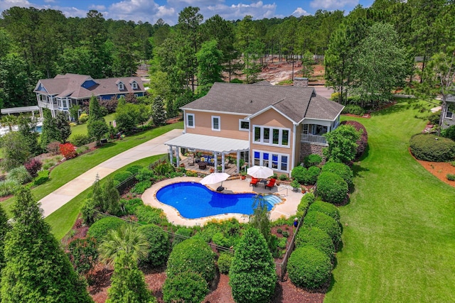 2051 Waterbridge Ln, Aiken, SC 29803 - back of property with a pergola, a yard, an outdoor pool, a patio area, and a balcony