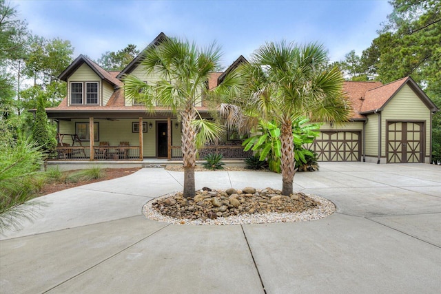 view of front of property featuring a porch and a garage