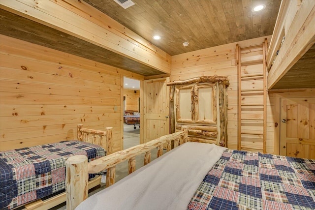 bedroom with wooden ceiling and wooden walls