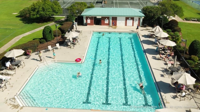 view of swimming pool featuring a patio area and an outdoor structure