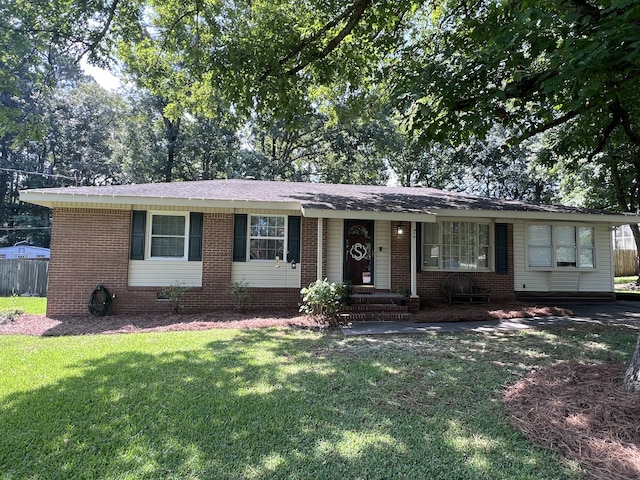 single story home featuring a front yard