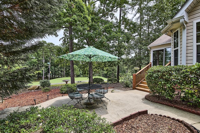 view of patio / terrace featuring a sunroom