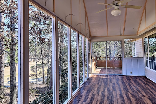 unfurnished sunroom with lofted ceiling and a ceiling fan