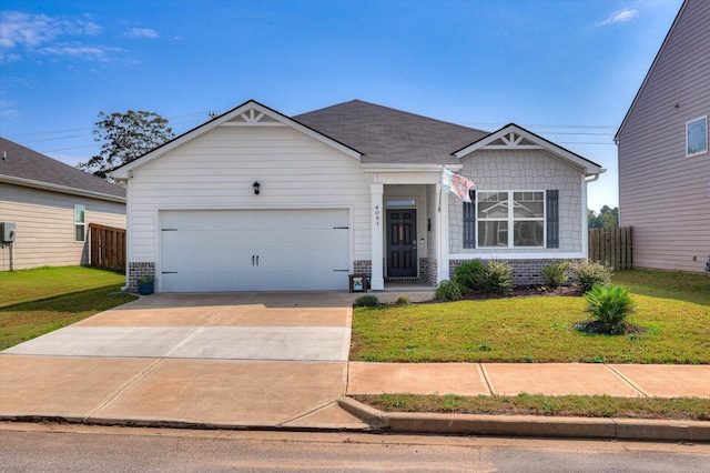 view of front facade with a front yard and a garage