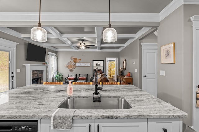 kitchen with white cabinetry, pendant lighting, and open floor plan