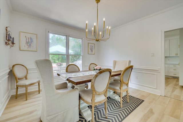 3555 Watervale Way, Martinez, GA 30907 - dining space featuring a chandelier, ornamental molding, a decorative wall, light wood-style flooring, and a wainscoted wall