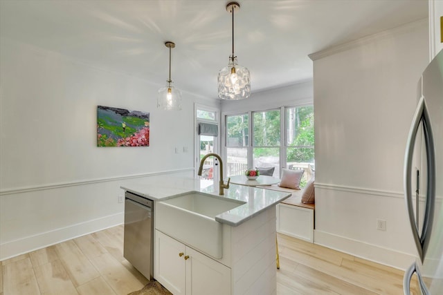 3555 Watervale Way, Martinez, GA 30907 - kitchen with appliances with stainless steel finishes, a sink, light wood-style flooring, pendant lighting, and white cabinets