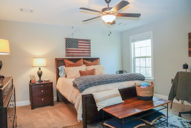 bedroom featuring ceiling fan and light colored carpet